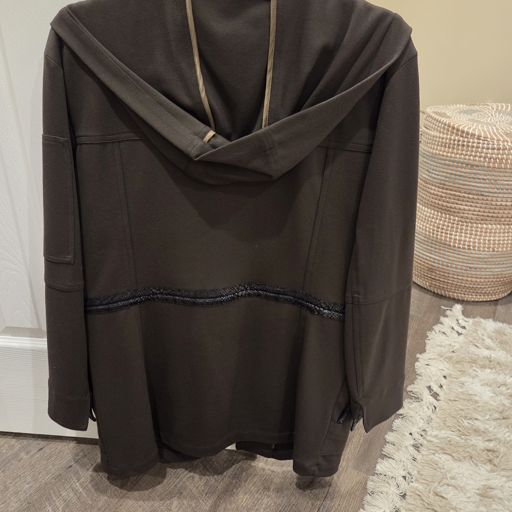 Dark Gren Hooded Jacket with Black Trim With No Zipper Its Drawstring.